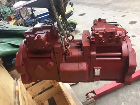 Pump installed on an SK120-V excavator under the machine's engine compartment