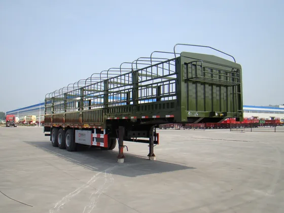 Side view of a 3-axle stake semi-trailer with 1200R20 tyres and leaf spring suspension