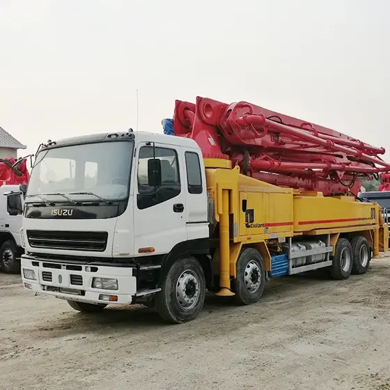 Side view of the pump truck with the 42-meter boom extended and five sections visible