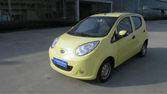Front three-quarter view of a white eOne-04 electric sedan with EEC L7e certification label