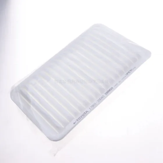 Side view of the air filter with visible paper element and housing