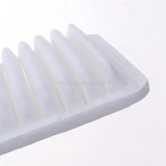 Filter placed on a flat surface with a ruler for scale reference