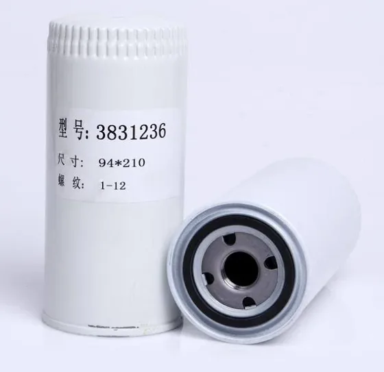 Iron-bodied oil filter with OEM number 3831236, mounted on a Volvo engine block
