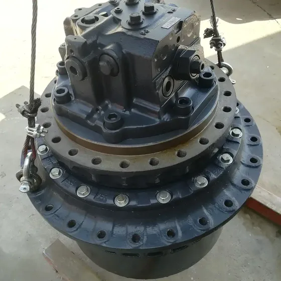 Final drive assembly with protective caps on hydraulic ports and mounting holes