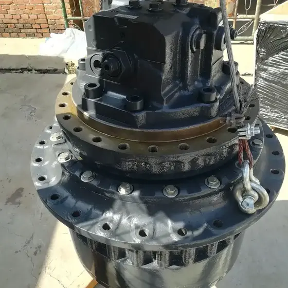 Front view of the travel motor with gear teeth and drive shaft visible