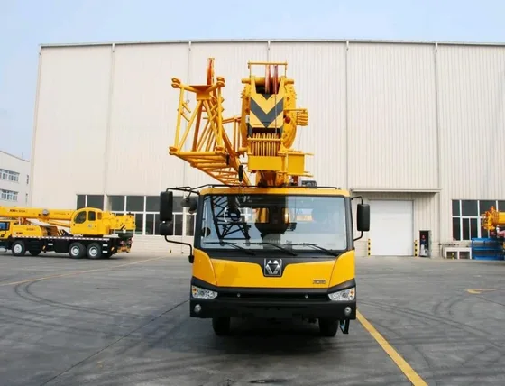 Rear view of the crane showing the chassis, engine compartment, and rear lighting