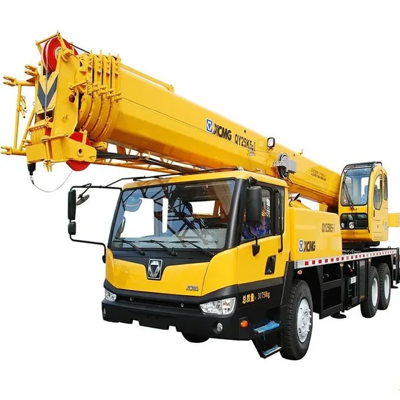 White QY25K-II truck crane parked on a construction yard, front three-quarter view with boom extended