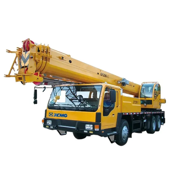 White QY25K-II hydraulic truck crane parked on a yard, front three-quarter view with boom extended