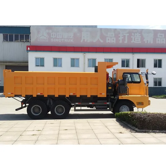 Side view of the HOWO 70T mining dump truck with raised dump body