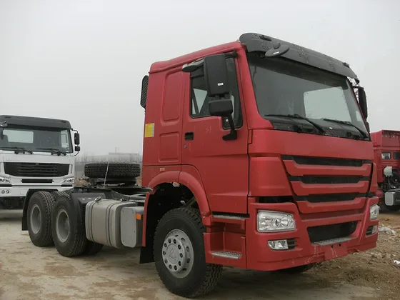 White HOWO 6x4 tractor head parked on a yard, front three-quarter view