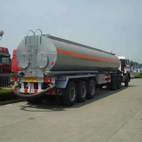 Pump and valve system mounted on the rear of the tank with filter gauze visible
