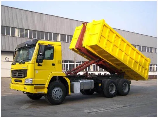 Rear view of the sweeper with water tank, dustbin door and rear lighting