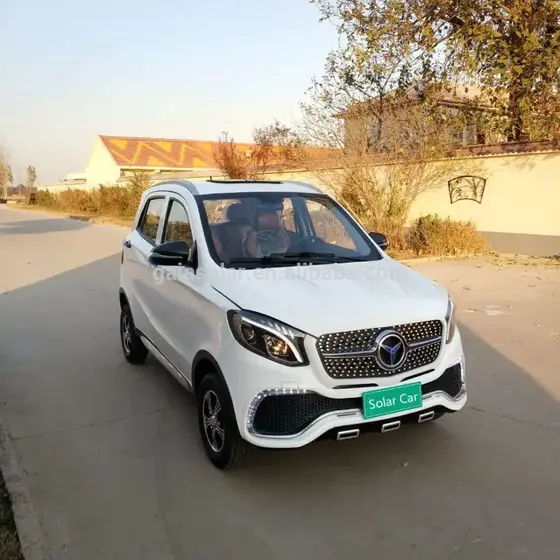 Front three-quarter view of a 4-person solar electric car with open sunroof and integrated headlamps