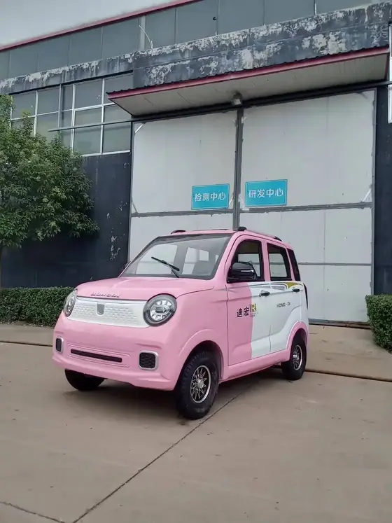 Front view of solar-powered electric car with integrated headlamps and white body
