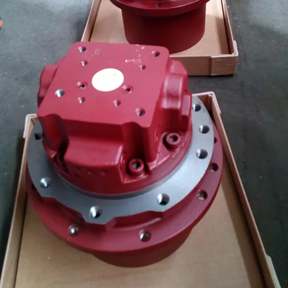 Travel motor installed on a PC30 mini excavator frame, showing mounting points and alignment