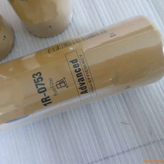 Black iron fuel filter 1R-0753 with threaded end, side view