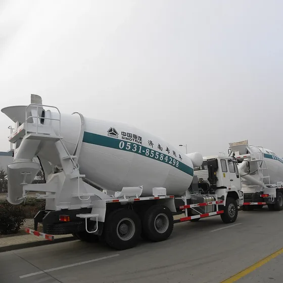 Rear view of the mixer truck with drum rotation mechanism and mud flaps