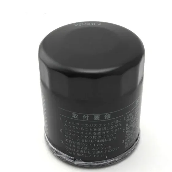 Side view of the oil filter showing the iron body, filter paper element, and mounting flange