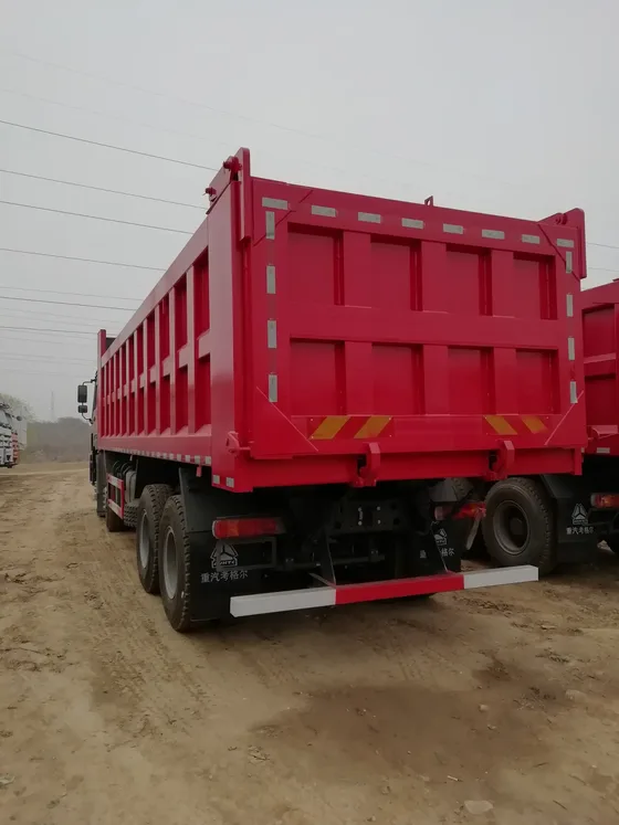 Side view of the HOWO dump truck showing the 3775+1400mm wheelbase and 12.00R20 tyres