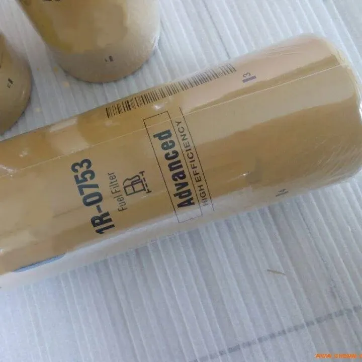 Black iron fuel filter 1R-0753 with threaded end, side view