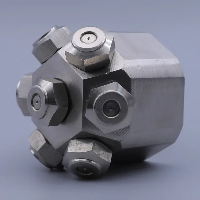 Stainless steel multi-port manifold block with hexagonal fittings and central orifices