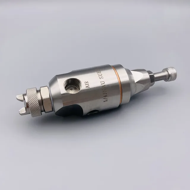 A stainless steel pneumatic component with threaded ports and knurled adjustment knobs