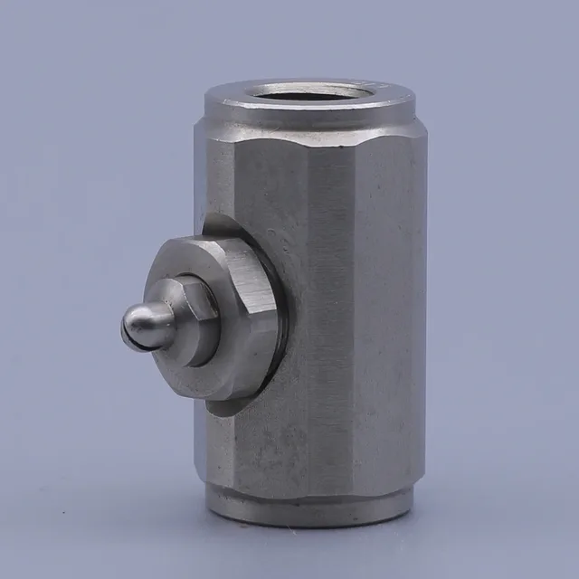 Stainless steel industrial fitting with a hexagonal body and a side-mounted adjustment screw