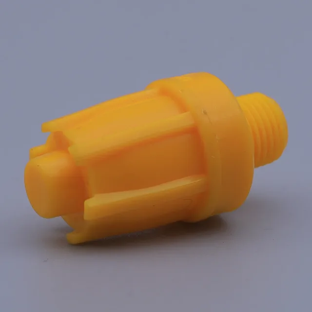 Yellow plastic threaded fitting with ribbed body