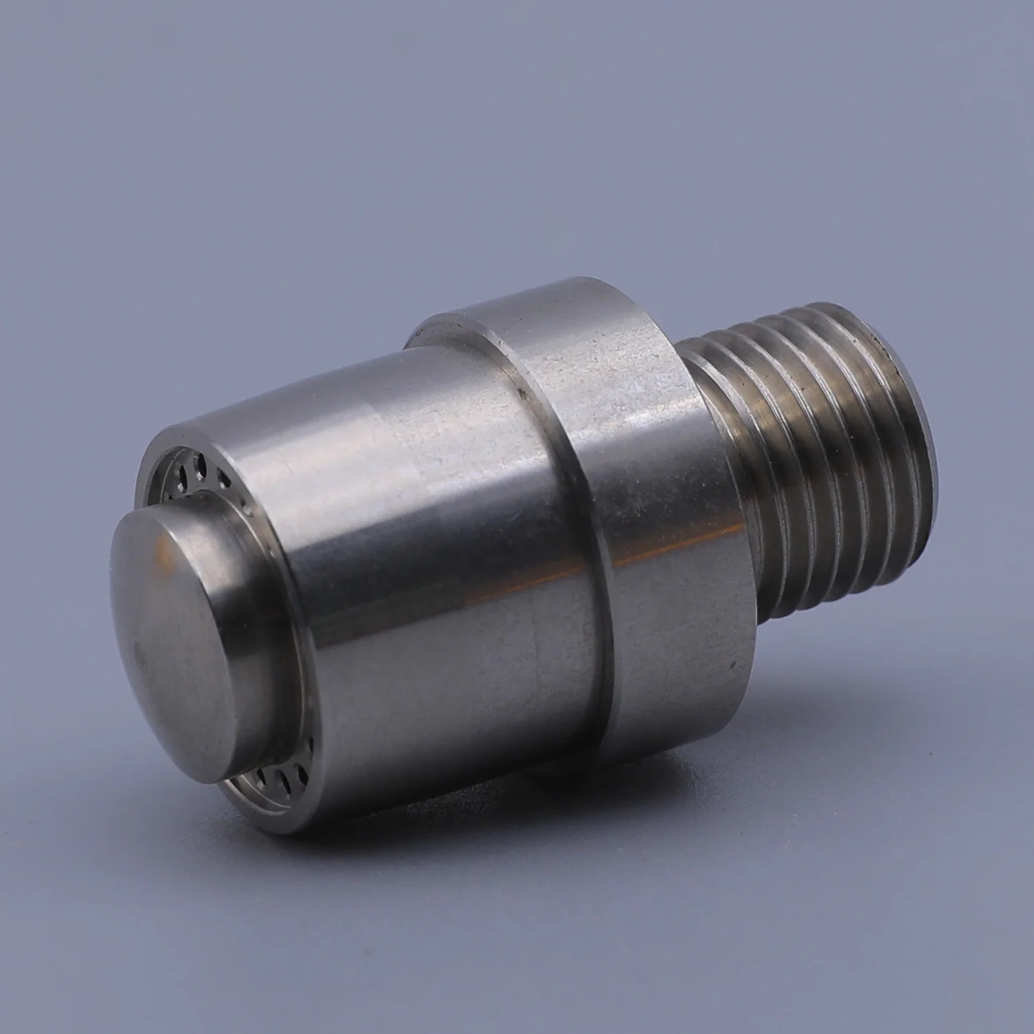 Stainless steel mechanical component with external threading and an internal bearing assembly