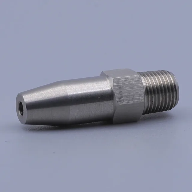 Stainless steel nozzle with external threads and a hex body on a plain background