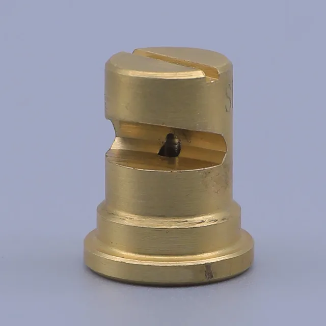 Brass cylindrical component with a side slot and central hole on a blue background