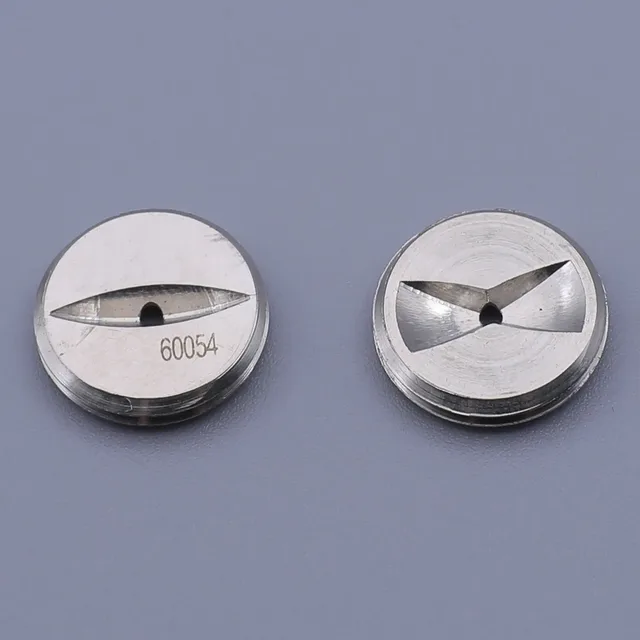 Two round metal extrusion dies, one with a single slot and one with a three-point star shape, on a grey background