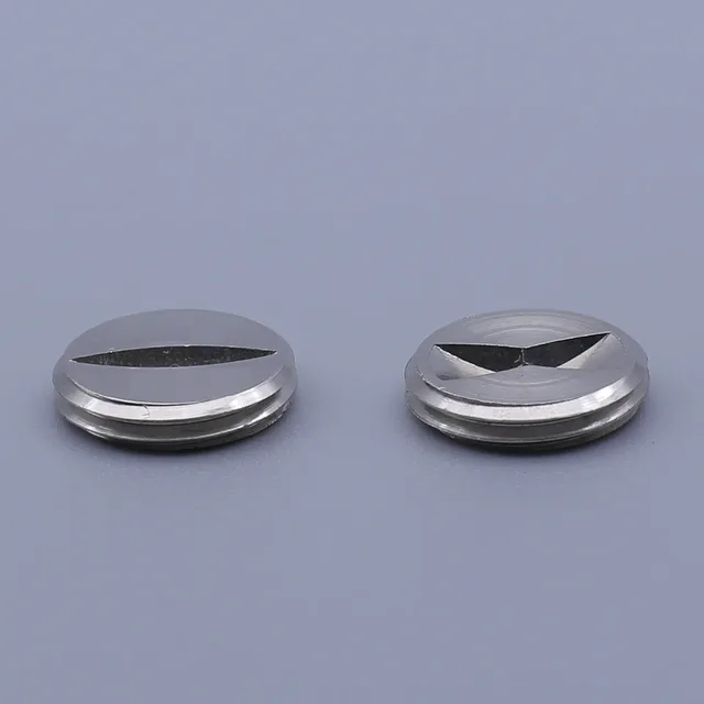 Two silver, circular metal components with a triangular cutout on top
