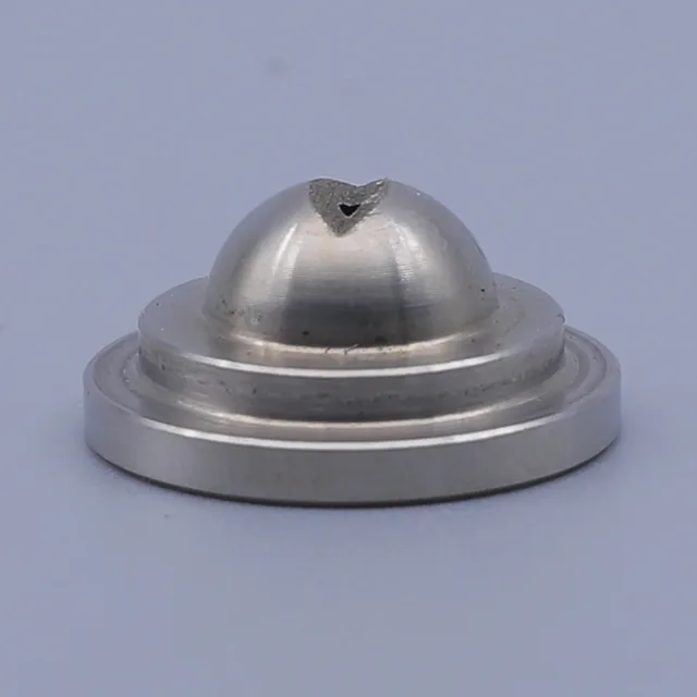 Metal component with a domed top and circular base, featuring a small V-shaped notch at the apex