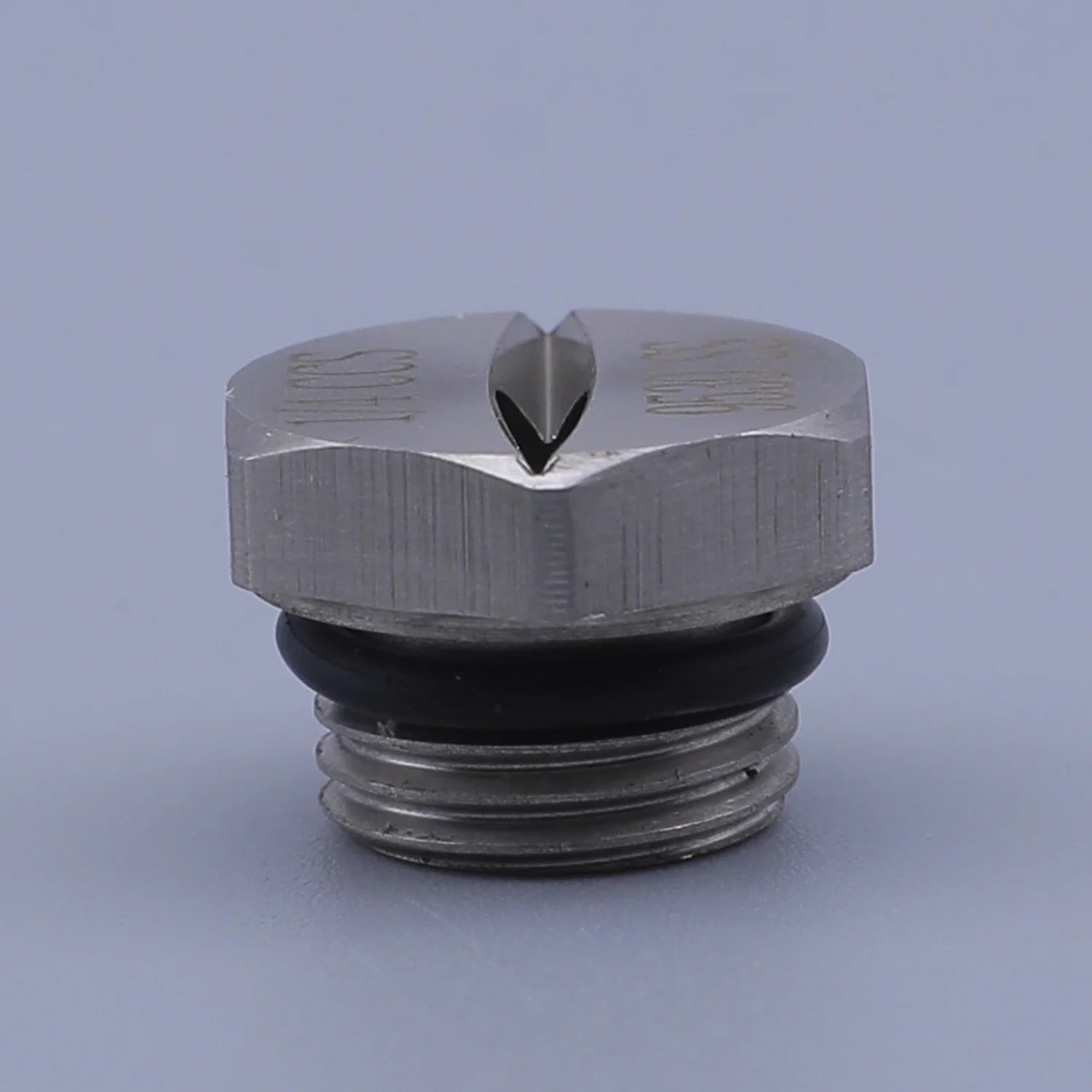 Stainless steel hex nozzle with V-shaped slit tip, black O-ring, and threaded base on a plain background