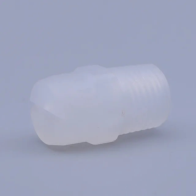 Translucent white plastic nozzle tip with external threading and a split front opening