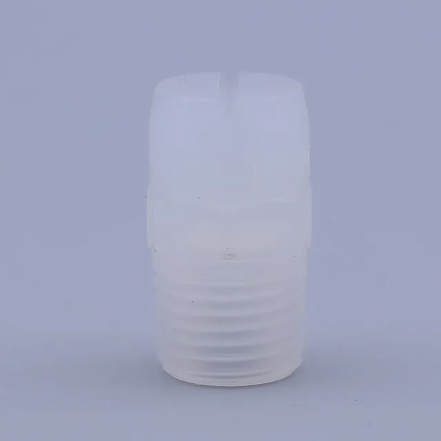 White translucent plastic threaded fitting or plug with a hex section, standing upright on a plain light blue background