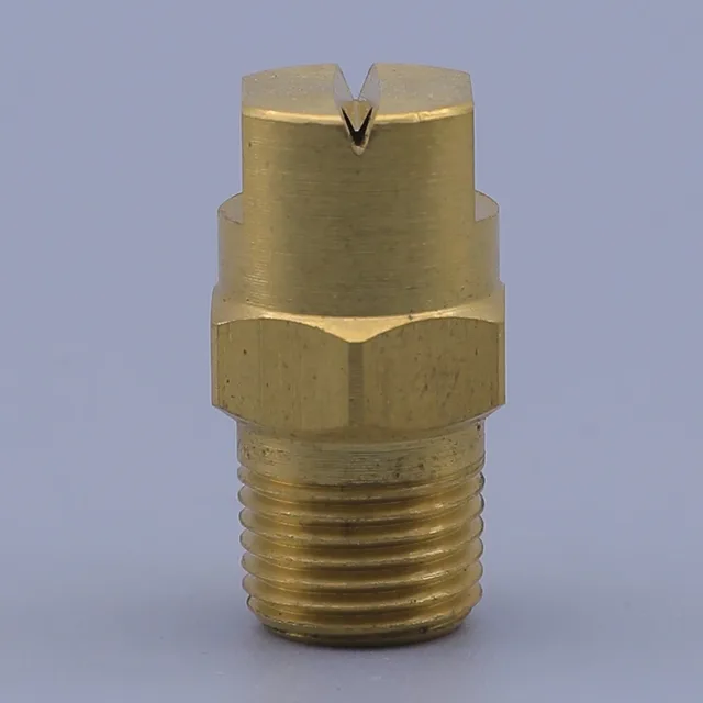 Brass nozzle with threaded base and hex nut on a gray background