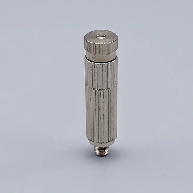 Vertical silver cylindrical metal component with knurled texture and threaded connector base on grey background
