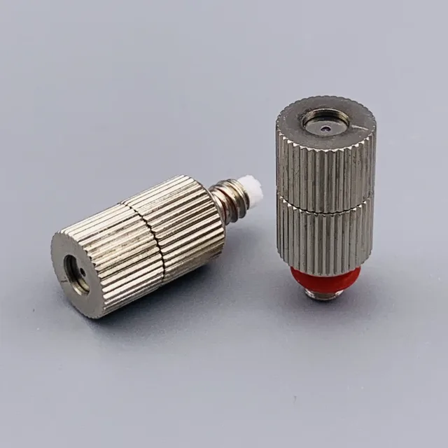 Two knurled stainless steel fluidic fittings with red gaskets and white ferrules