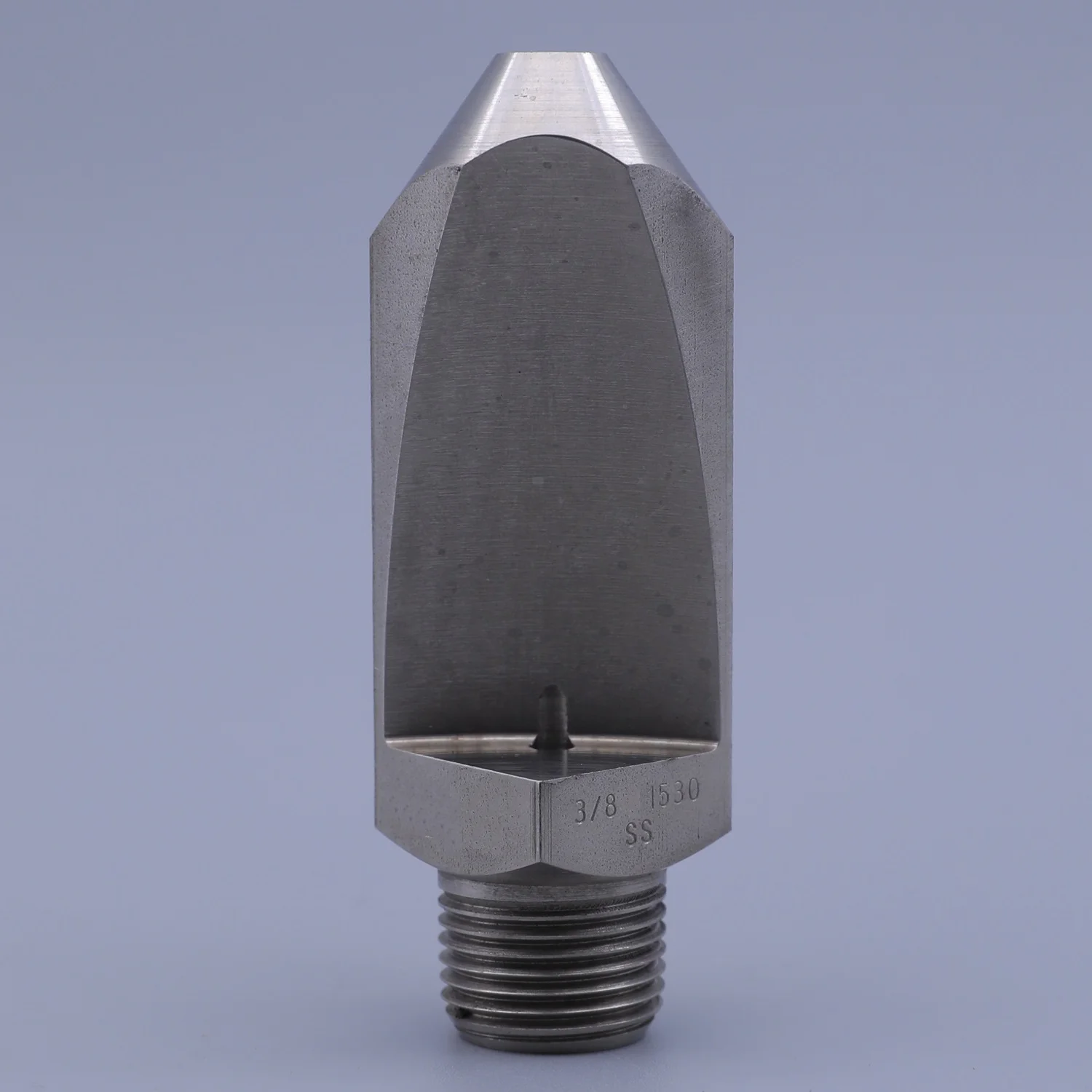 Close up of a stainless steel flat fan spray nozzle with a threaded connection