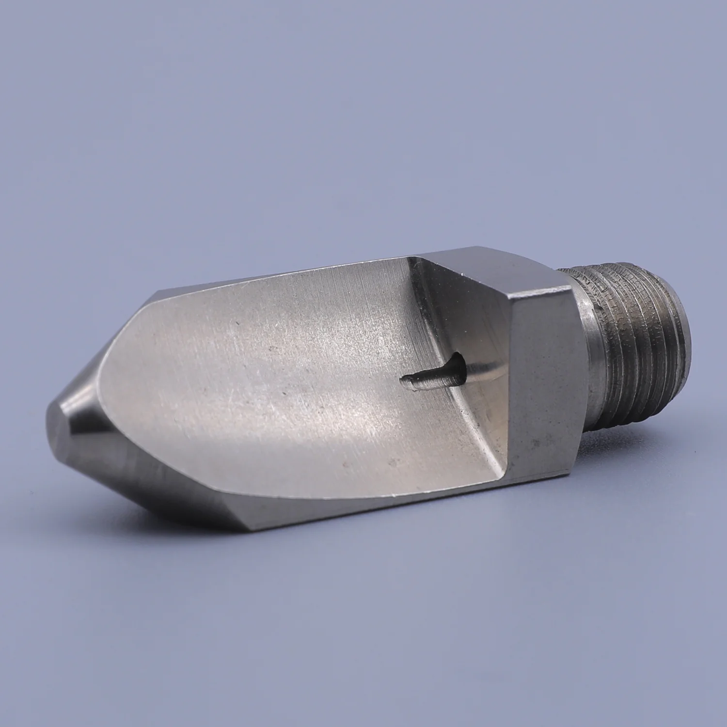 Stainless steel industrial spray nozzle with external threads and a flat fan spray pattern