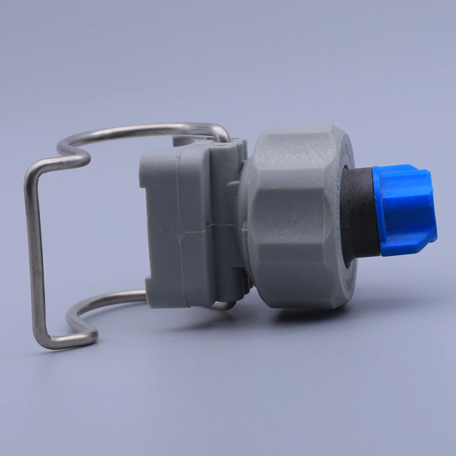 A grey plastic valve with a blue cap and a metal mounting bracket