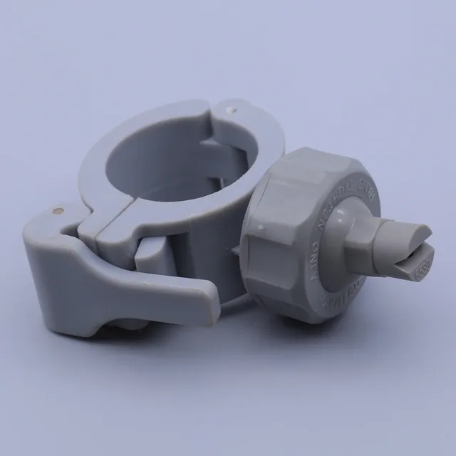 Grey plastic clamp with hex nut and wing screw against a light background