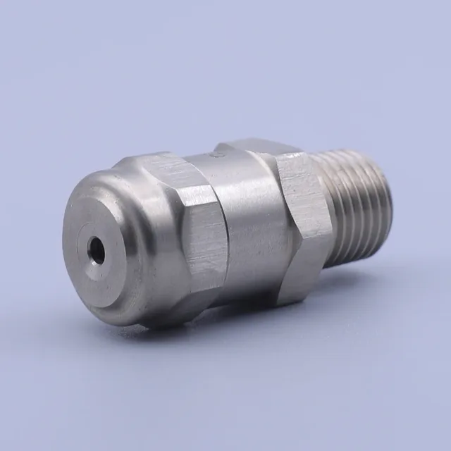 Stainless steel hexagonal nozzle with a small orifice and male threaded connection on a blue background