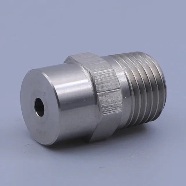 Stainless steel threaded fitting with hex body and small central bore on a plain background