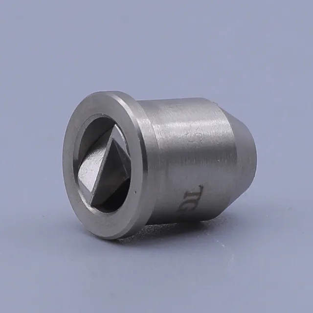 A close-up of a cylindrical metal component with a diamond-shaped aperture on a plain background