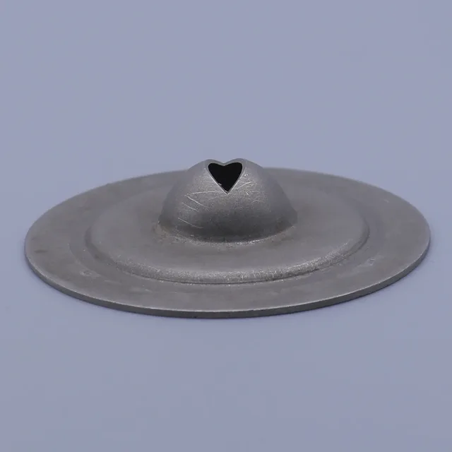 Gray metal vent cap with a heart-shaped opening on a central dome
