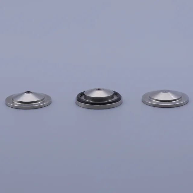 Three silver metallic conical components arranged in a row on a plain background