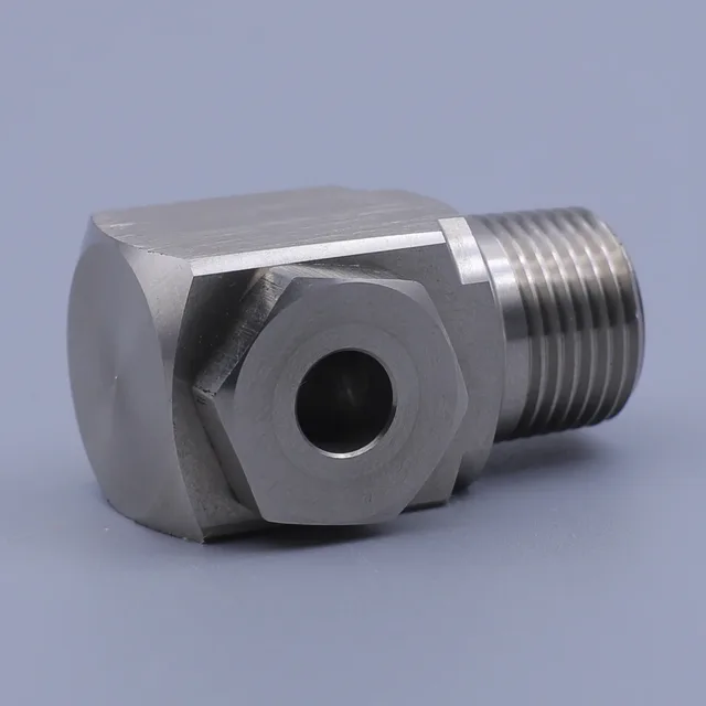 Stainless steel right angle hex fitting with male thread on plain background